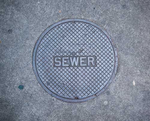 Seattle sewer repair on a cracked pipe under foundation of older home